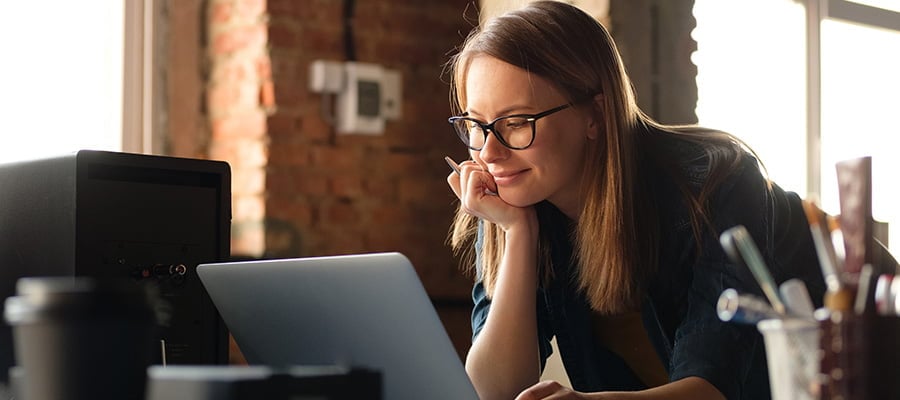 Woman at a laptop designing a Murphy Bed