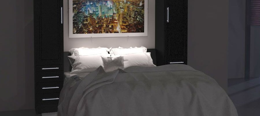 A Murphy Bed at night with 3 lights shining onto bedding